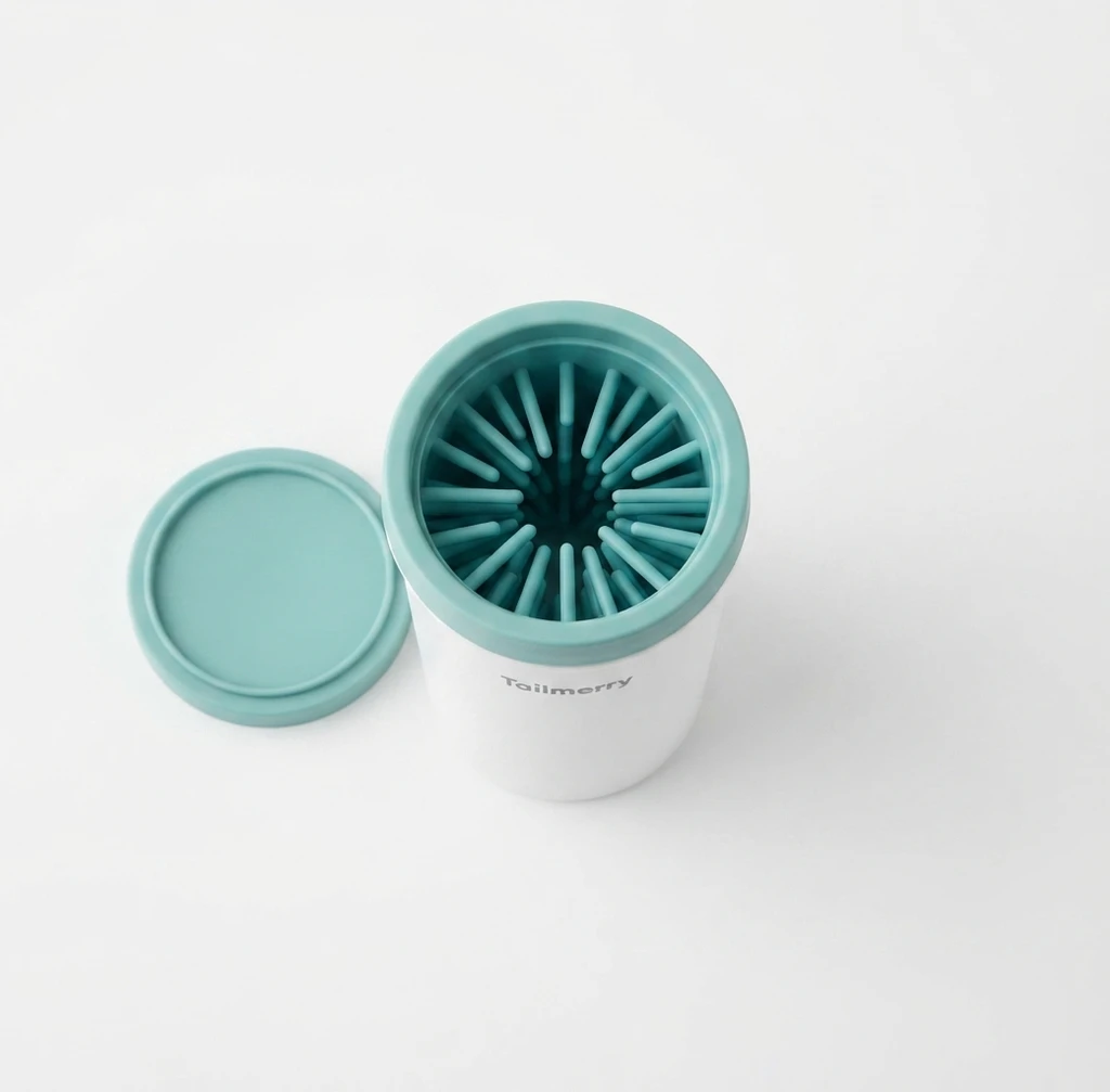 Tailmerry branded silicone paw cleaner cup in white and mint green with lid removed, showing soft silicone bristles